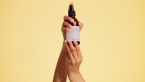 Hands,-spray-and-bottle-with-beauty