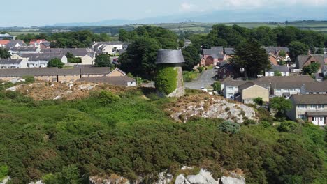 disused llangefni windmill ivy covered hillside landmark aerial view overlooking welsh anglesey snowdonia countryside