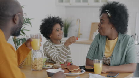 happy family enjoying breakfast