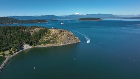 aerial view of a motorboat quickly coming into the anacortes harbor