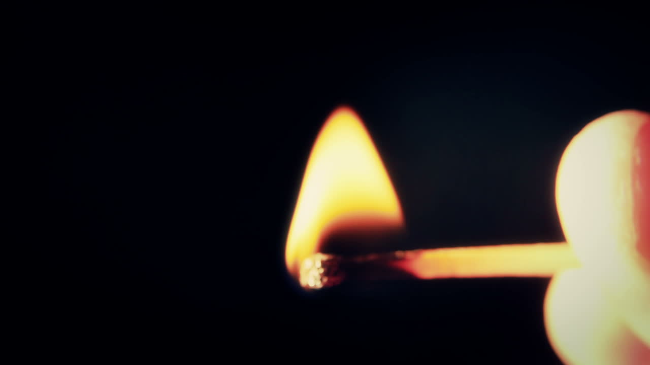 Close-up of a Match Being Struck and Igniting