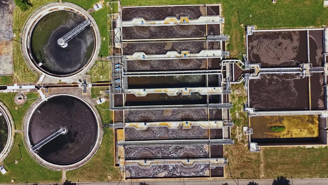 Insightful aerial view highlighting treatment plant infrastructure components. Detailed drone imagery showcasing various elements of sewage treatment facilities and processes