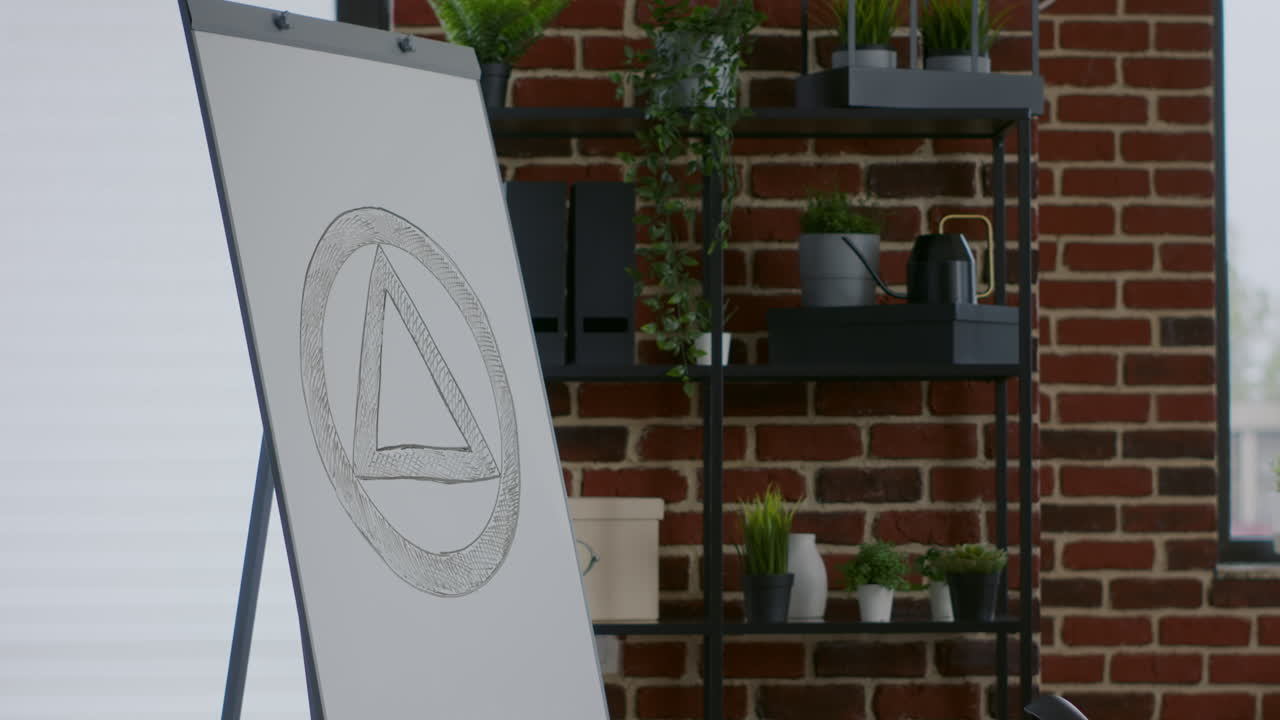 Close up of aa meeting sign on white board in therapy session space with chairs in circle