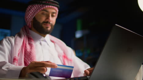 man adds credit card info online