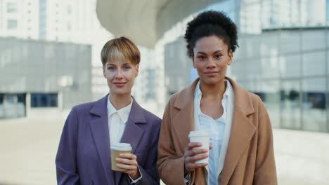 two businesswomen enjoying coffee break