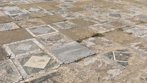 Sunny-day-over-ancient-Roman-mosaic-flooring-in-Carthage,-Tunisia,-historic-site