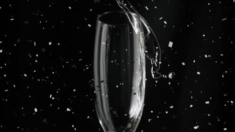 Animation-Von-Champagner,-Der-In-Ein-Glas-Strömt,-Während-Konfetti-Auf-Schwarzen-Hintergrund-Fällt