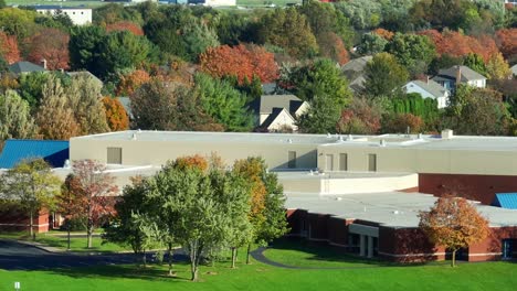 american school with autumn trees in neighborhood