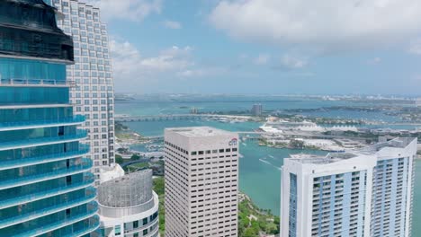 fly around skyscraper under construction. revealing panoramic view of coast, islands and sea cruise terminal. miami, usa