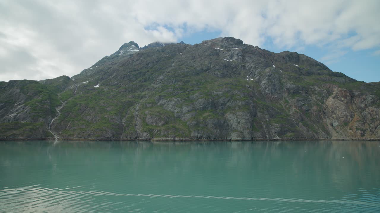 Beautiful mountains in Glacier Bay, Alaska seen from a moving ship. For projects requiring longer clips in higher resolution, visit StockPlates.