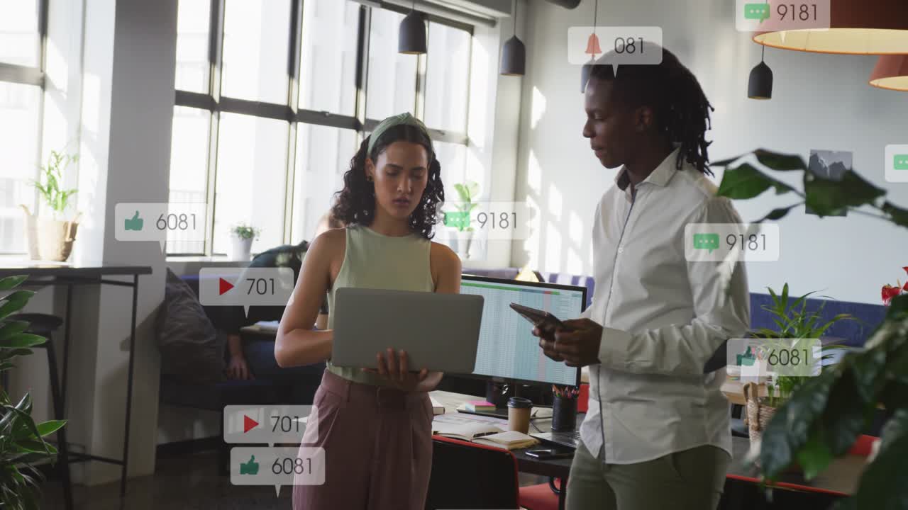 Woman holding laptop, man checking phone at desk, tapping, causing animated metrics rising for ads