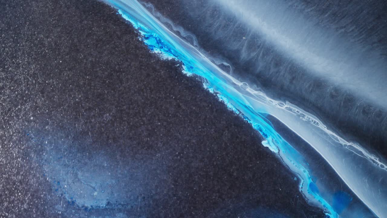 Stunning blue and white alcoholic ink blending in abstract macro texture