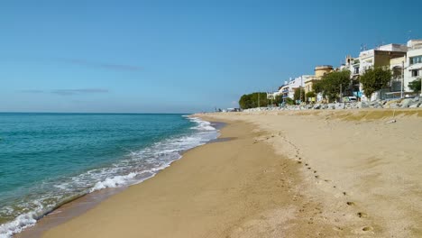 platja de les barques sea field maresme barcelona mediterranean coast plane close to turquoise blue transparent water beach without people