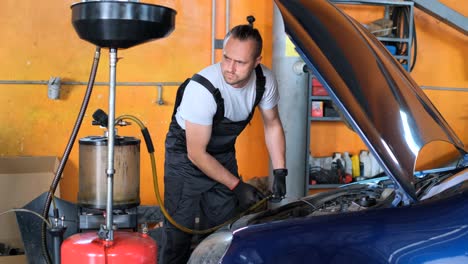 mechanic performing car maintenance in an auto shop