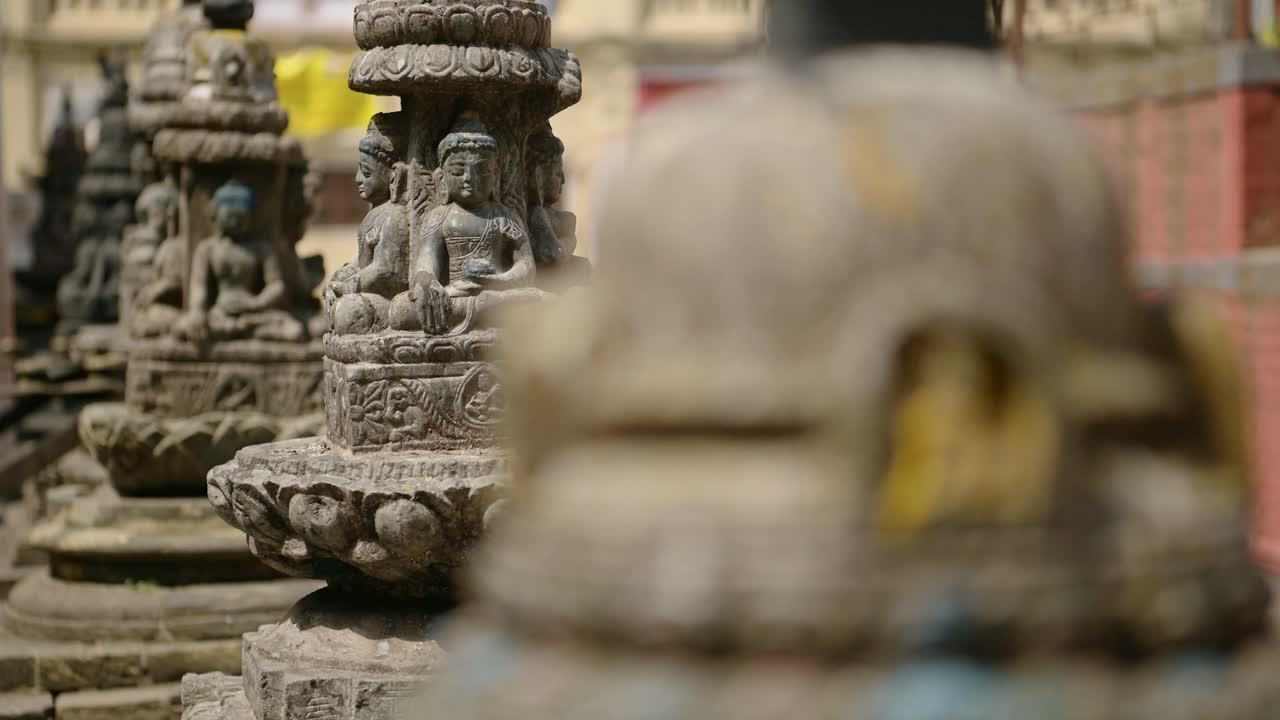 Buddha Statue at Buddhist Temple in Kathmandu Nepal, Close Up Detail and Reveal of Buddhist Stone Statues at a Famous Religious Site for Buddhism Religion