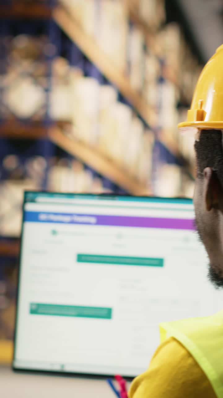 Vertical Video Black warehouse team overseeing incoming pallets shipment of goods
