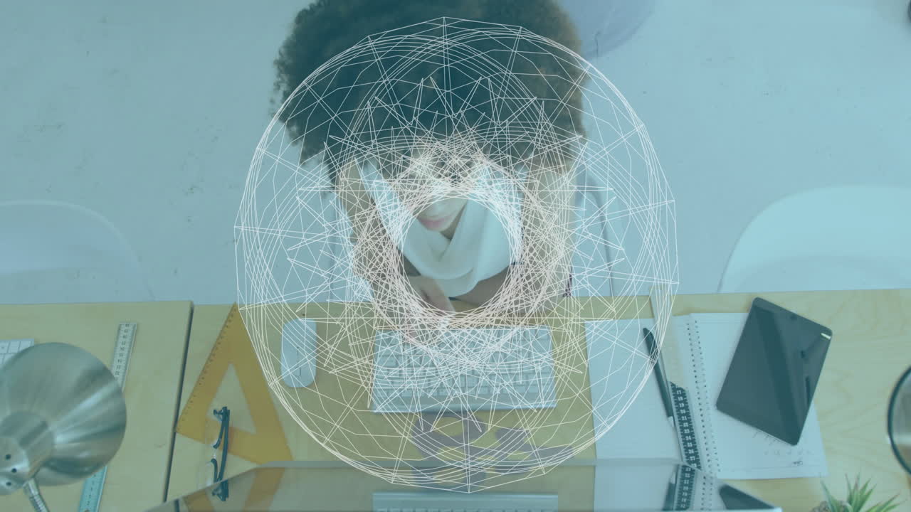 Geometric network animation over person working at desk with architectural tools