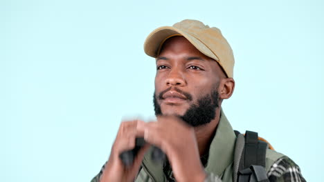 Black-man-in-studio-with-binoculars-for-hiking