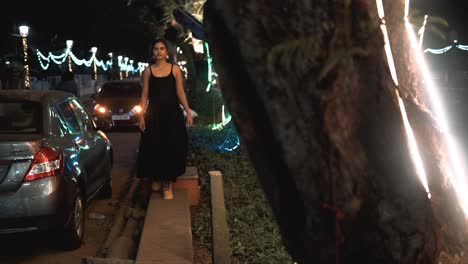 girl walking in a beautiful black dress, nightlife