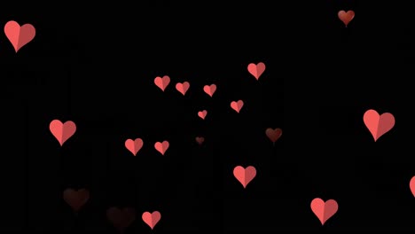 Animation-Von-Rosa-Herzen,-Die-über-Schwarzem-Hintergrund-Schweben