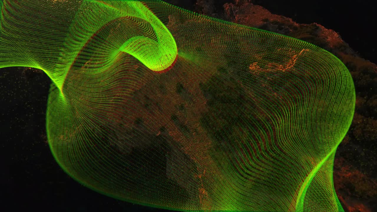 Sun reflection rising, green ribbon mesh sweeping, tightening, looping and revealing coastal cliffs