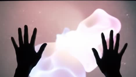 engaging interaction with fluid visuals: captivating light patterns and hand movements create a hypnotic experience in an artistic digital space