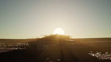 old-rusty-tank-in-the-desert-at-sunset