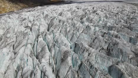 Flying-above-Aletsch-Glacier,-Switzerland-during-the-day-in-summer