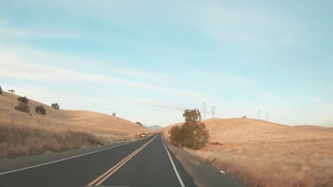 a long time lapse video of driving in the country hills