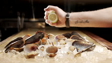 cook squeezing lime over seafood