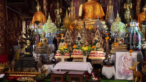 buddhist statues inside wat chiang man temple in thailand