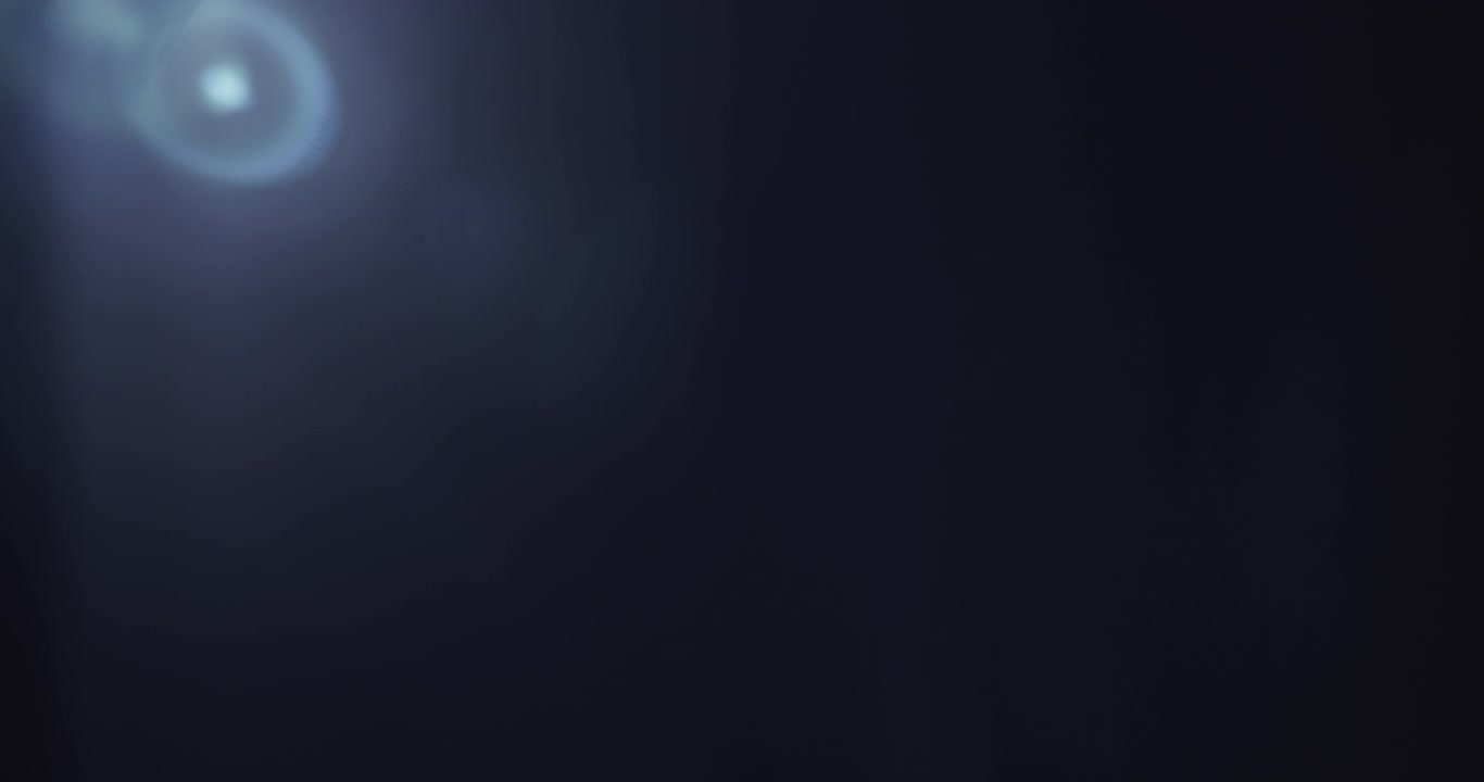 Soft blue lens flare with a gentle light gradient across a clear black background. Ideal for overlays, transitions, visual effects, or adding atmosphere to creative projects