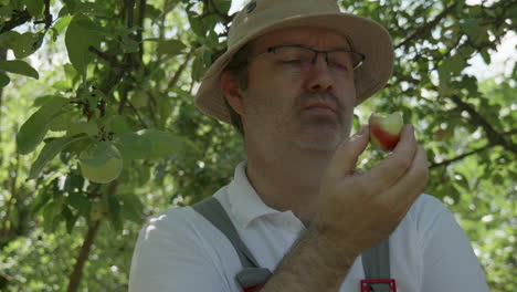 gardener eating freshly picked apple