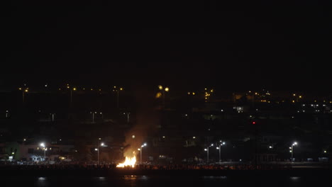 bonfire on waterfront at san juan festival in lanzarote