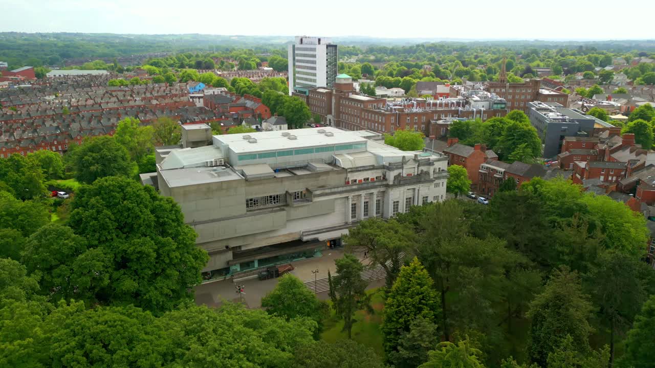 Overhead reversing aerial video of Ulster Museum in Botanic Gardens in Belfast, Northern Ireland on a bright sunny day. Produced in 4K, 60 frames per second and with Rec709 color.
