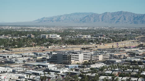 Las-Vegas-morning-traffic-crawls-along-I-15,-with-the-rugged-beauty-of-desert-mountains-in-the-background