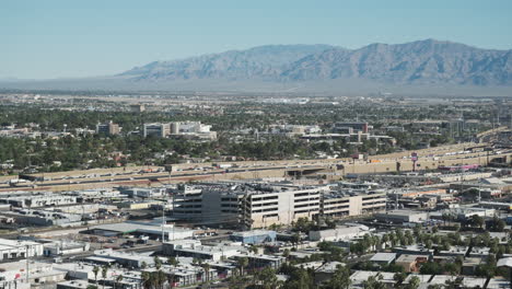 las vegas morning traffic crawls along i-15, with the rugged beauty of desert mountains in the background