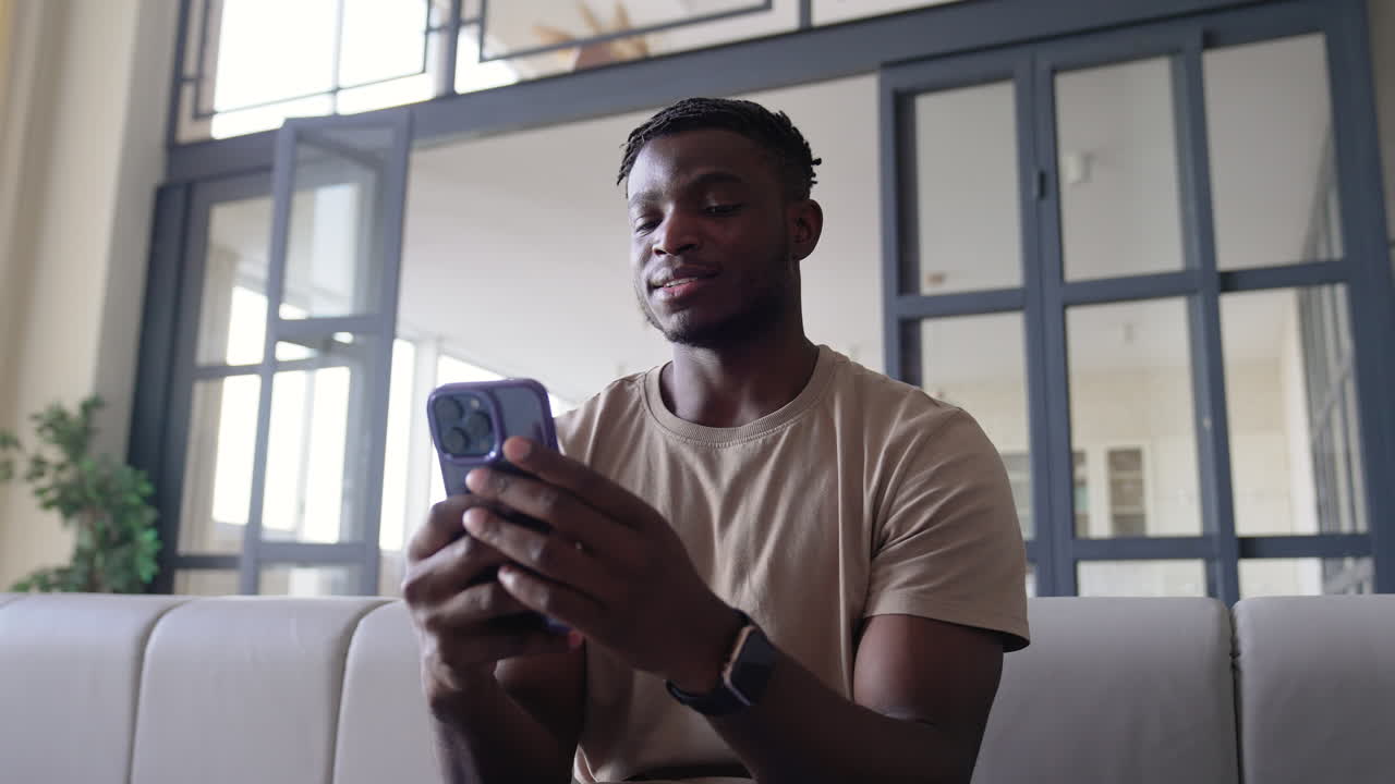 Man using phone at home