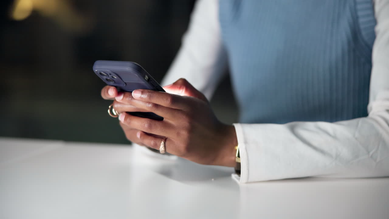 Close Up of Person's Hands Typing on a Smartphone
