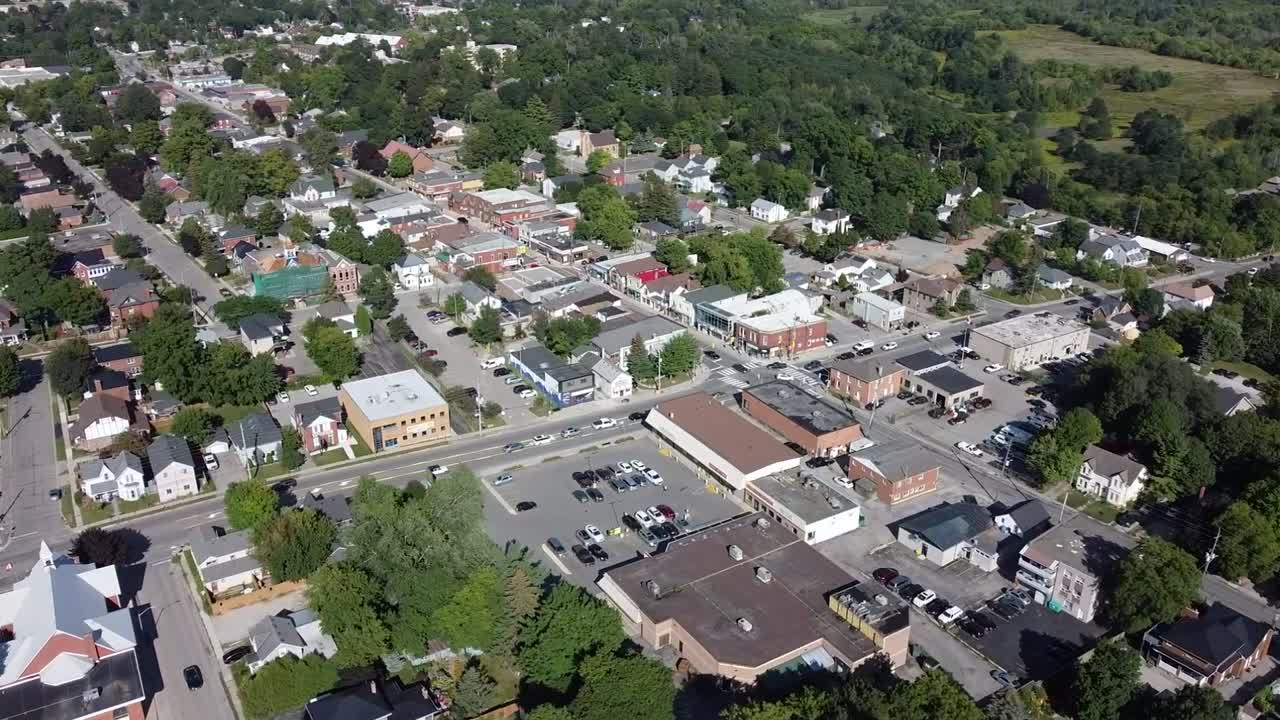 Drone circling over downtown shopping area in Acton