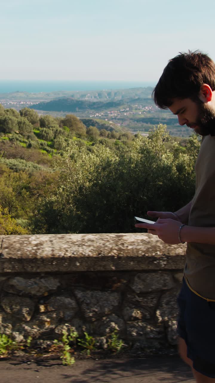 Athlete Relaxes While Walking And Chatting On His Smartphone