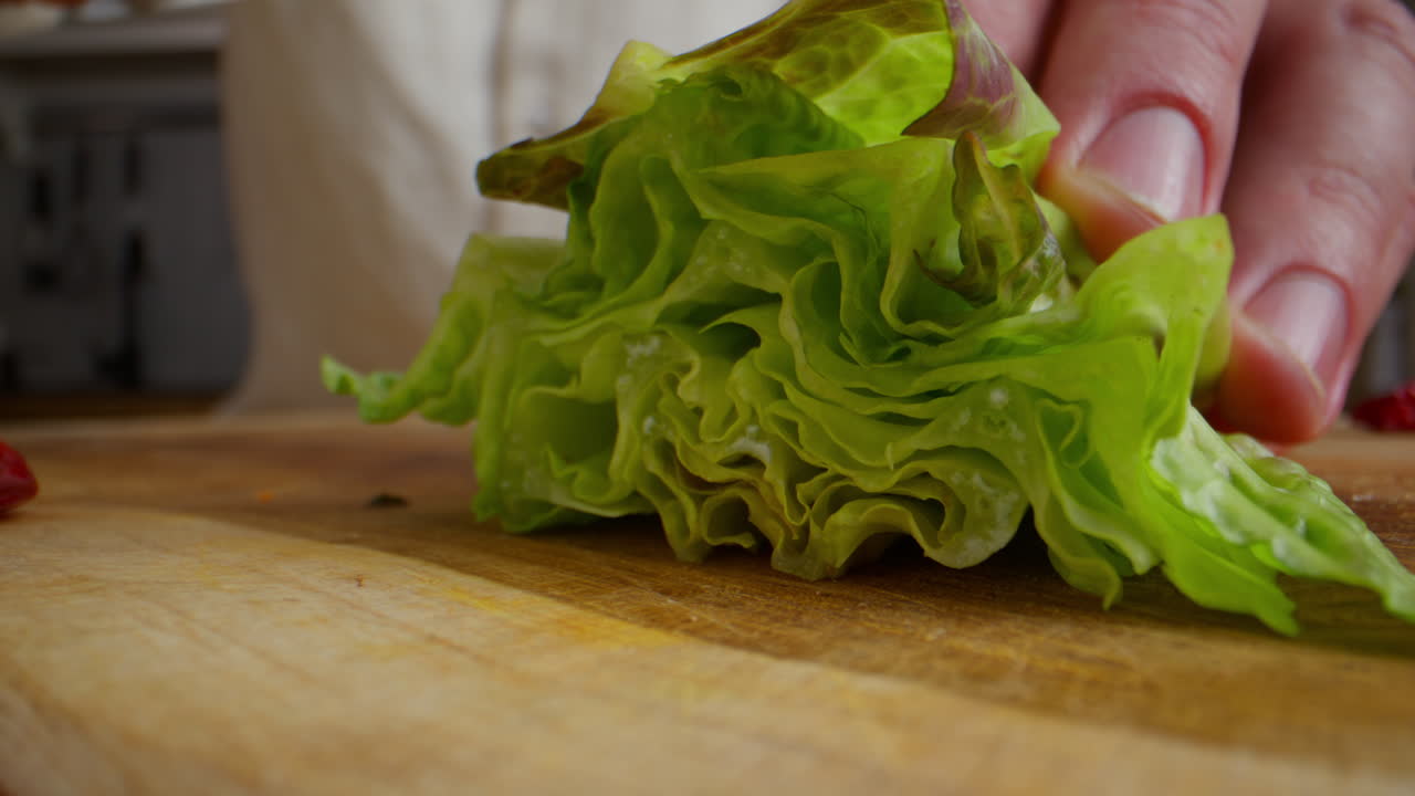 Chef chopping lettuce for a salad