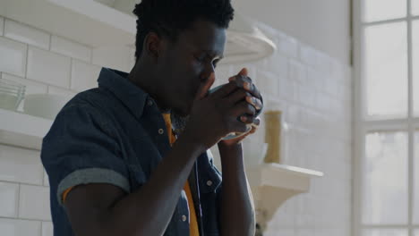 man enjoying coffee in the kitchen