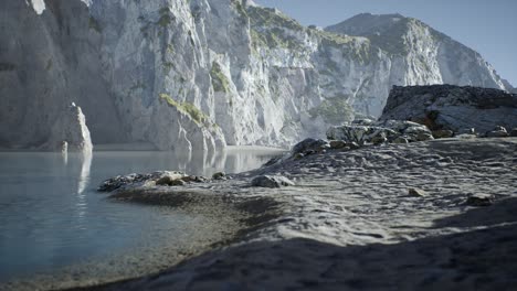 sand beach among rocks at atlantic ocean coast in portugal