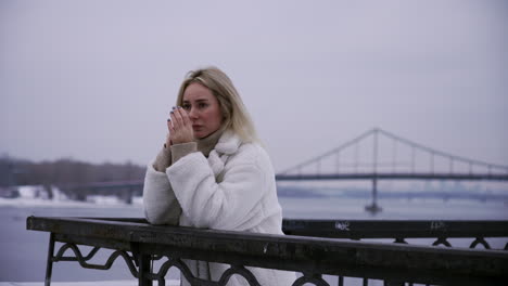 worried woman standing outdoors