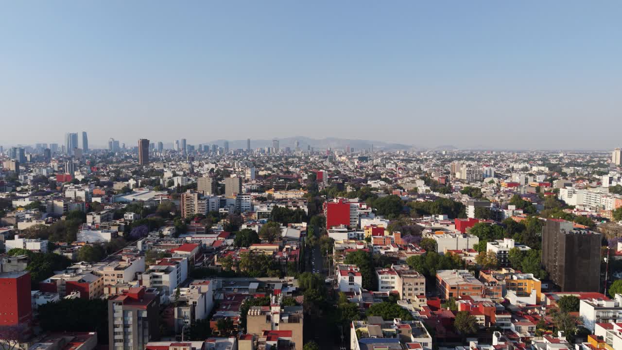 Aerial drone tour of CDMX on a sunny afternoon