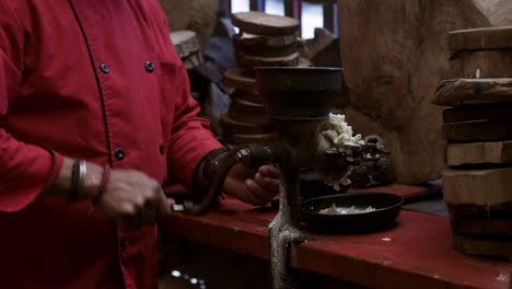 person grinding food