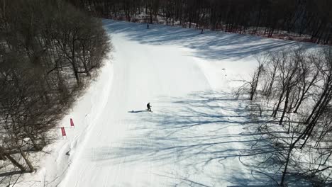 Aerial-gootage-of-a-young-snowboarder-doing-downhill-ride-at-yabuli-resort