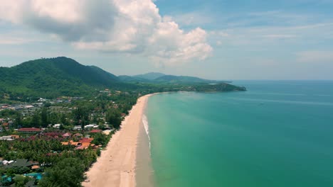 4K-Cinematic-nature-drone-footage-of-a-panoramic-aerial-view-of-the-beautiful-beaches-and-mountains-on-the-island-of-Koh-Lanta-in-Krabi,-South-Thailand,on-a-sunny-day