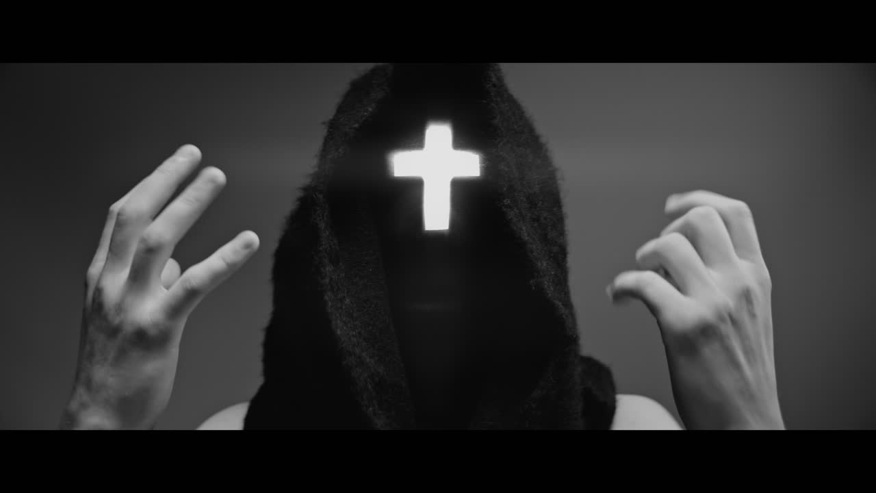 Masked man with cross of light glowing on his face preach